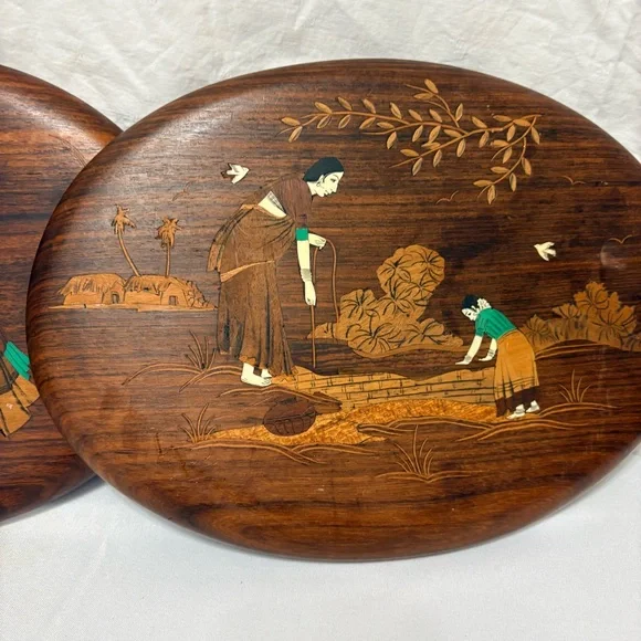 Vintage Indian rosewood wall art plaques with intricate bone inlay designs.